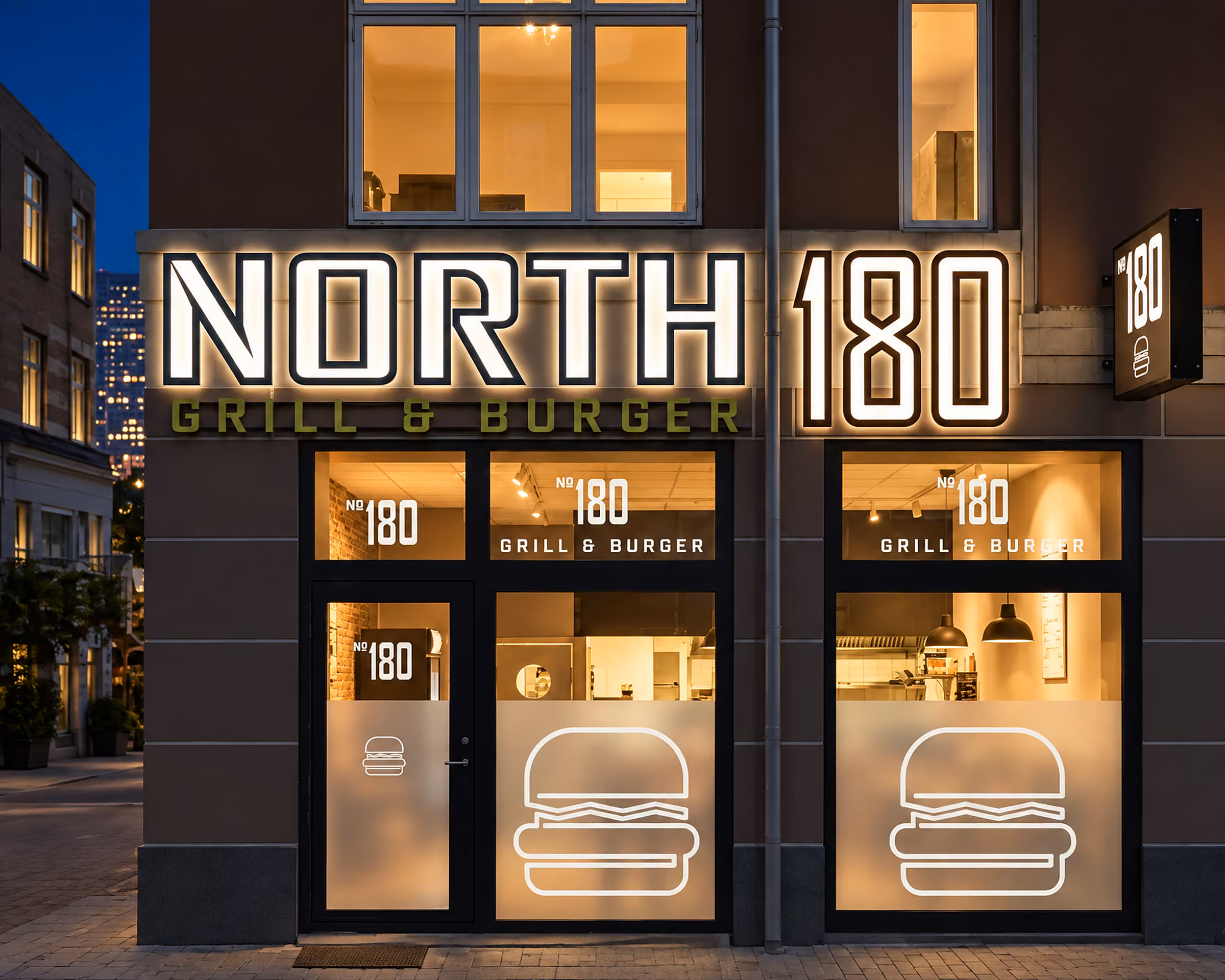 Lysskilt og vinduesfolie på North 180 Grill & Burger om aftenen